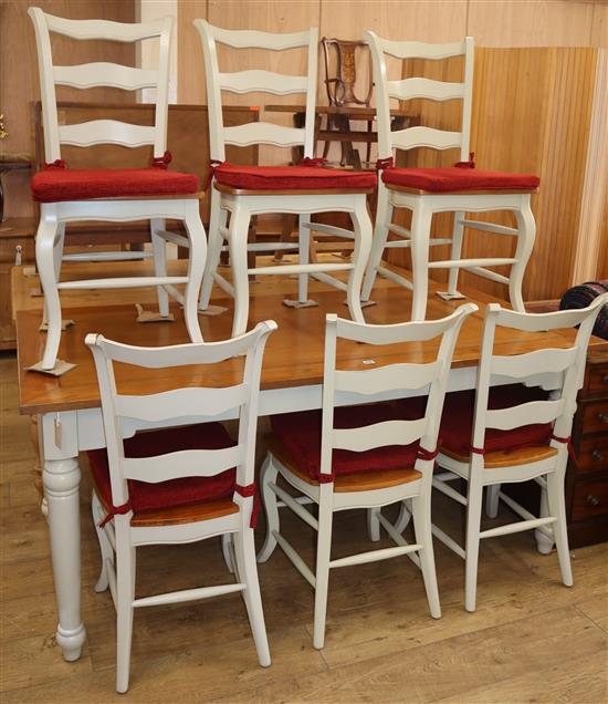 A pale green painted pine topped kitchen table, with six matching French style dining chairs (7) Table 180cm